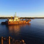 Tugboat Warringa leads the LC Sarafenua on her final voyage from Port Vila to Luganville, Santo.