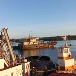 Tugboat Warringa leads the LC Sarafenua on her final voyage from Port Vila to Luganville, Santo.