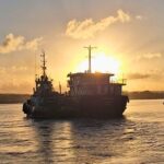 Tugboat Warringa leads the LC Sarafenua on her final voyage from Port Vila to Luganville, Santo.