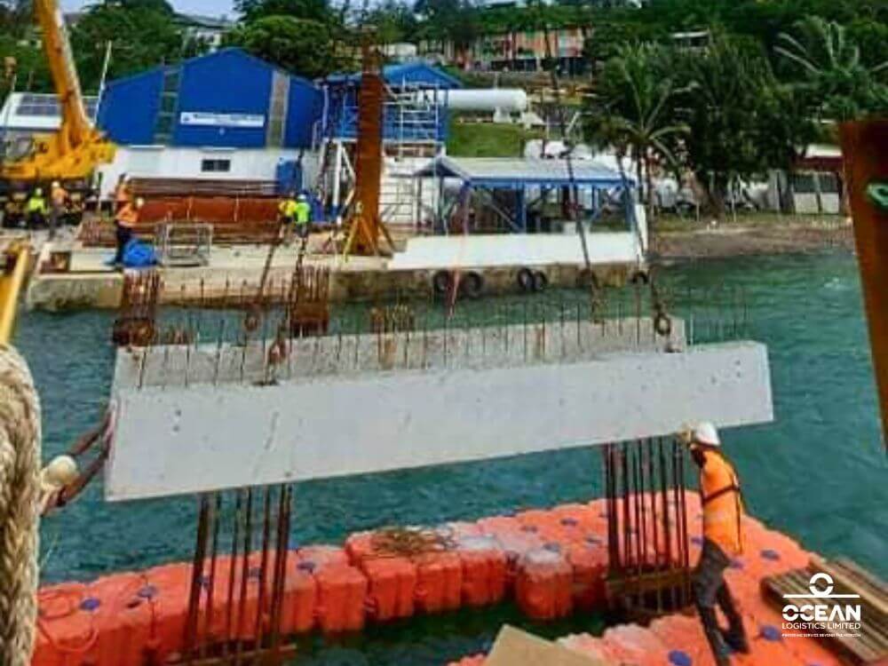 Jitendra Lal Sharma, the Site Manager and Crane Operator at Ocean Logistics Limited, along with his son Shail, supported the McConnell Dowell team in advancing the construction of the new Mala Base Wharf.